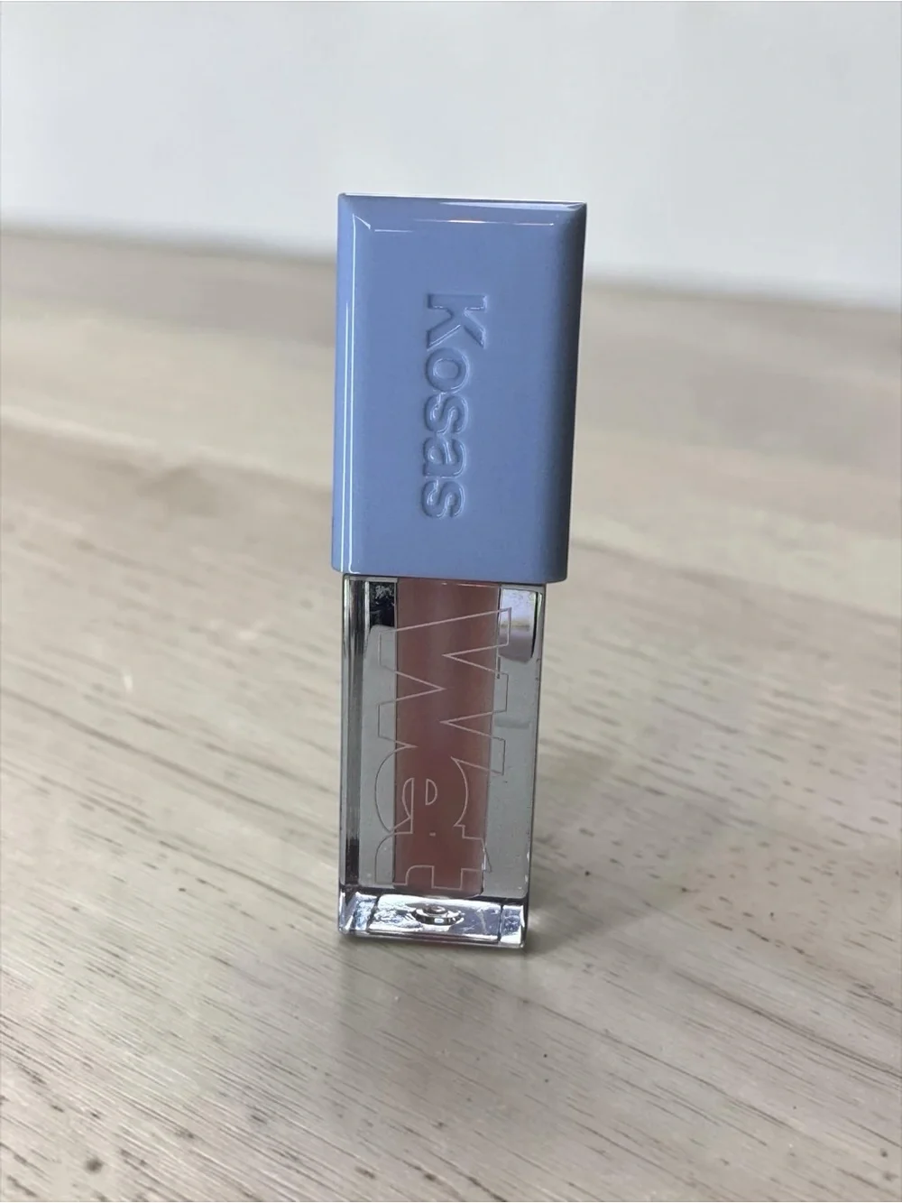 Kosas Gloss in Nude Beige with Lavender Cap